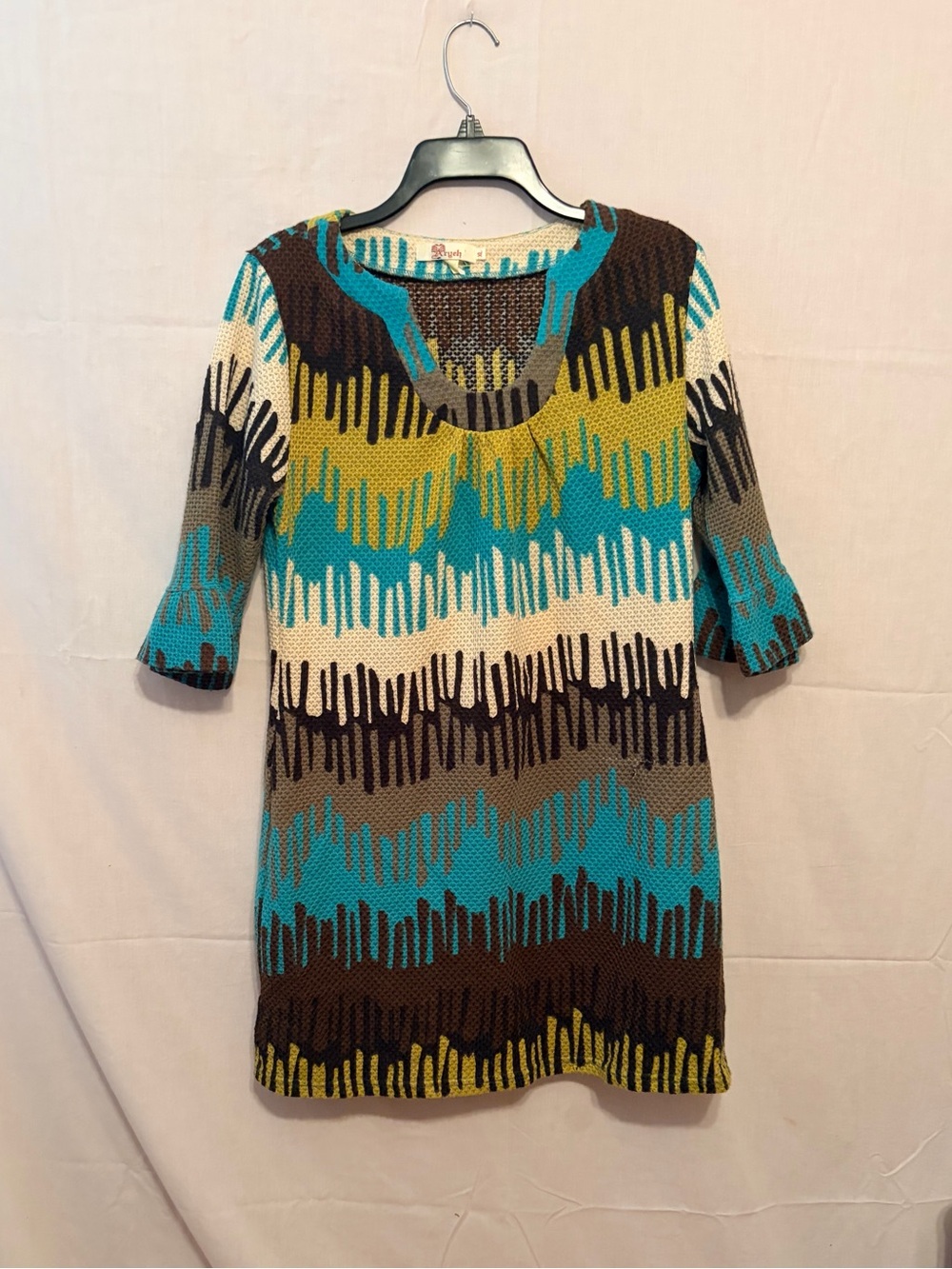 Aryeh retro knit tunic dress with a teal, olive green, & brown geo drip pattern